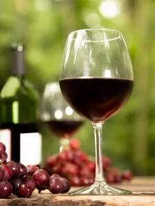 a glass of low acid red wine
