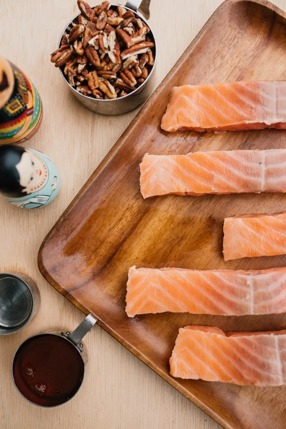 Ingredients for honey pecan crusted salmon including salmon fillets, honey, coconut oil, and pecans