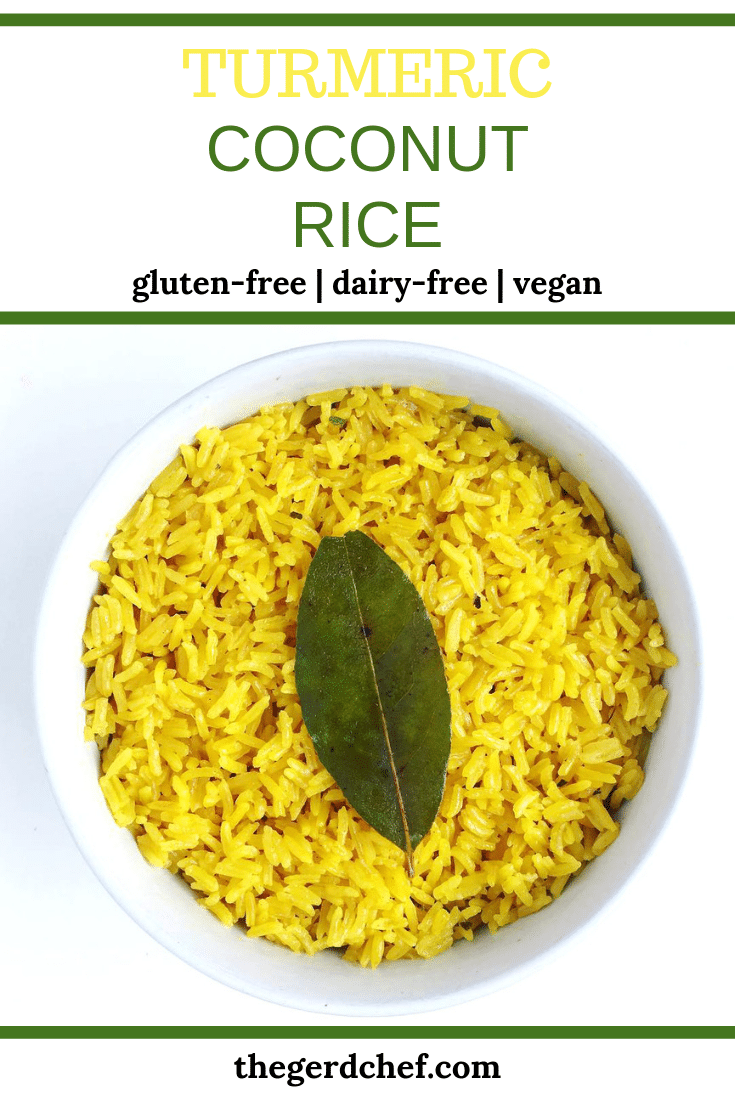 A bright yellow colored bowl of coconut turmeric rice topped with a bay leaf