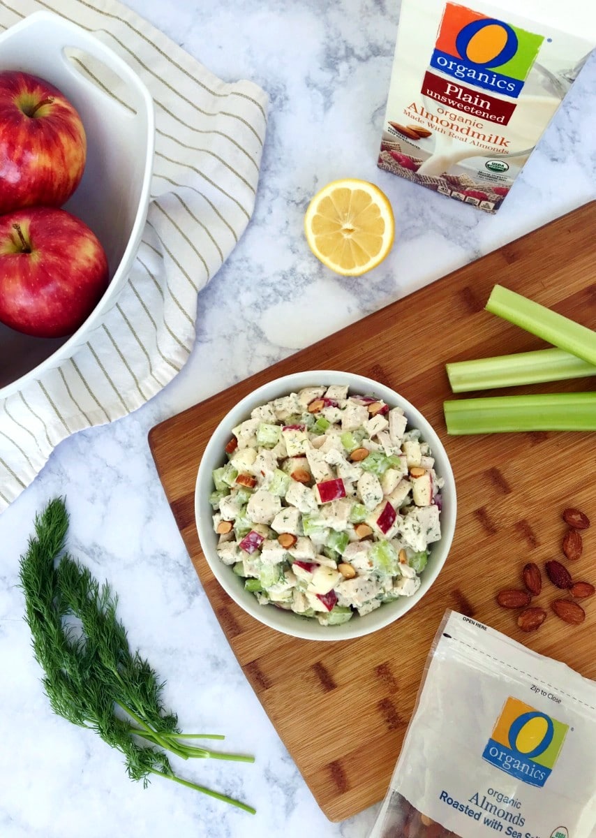 Fresh Dill Chicken Salad in a bowl surrounded by almond milk, apples, fresh dill, celery, and almonds