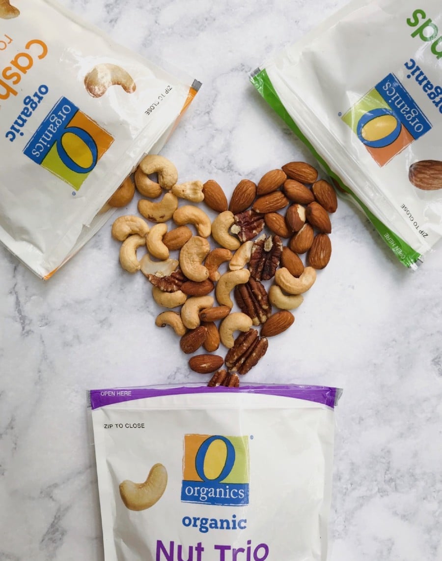 3 bags of O Organics Nuts spilling into the shape of a heart.