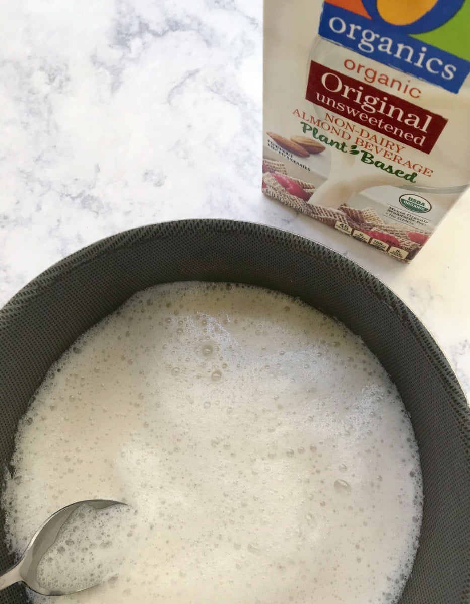 A sauce pan with frothed O Organics Almond Milk