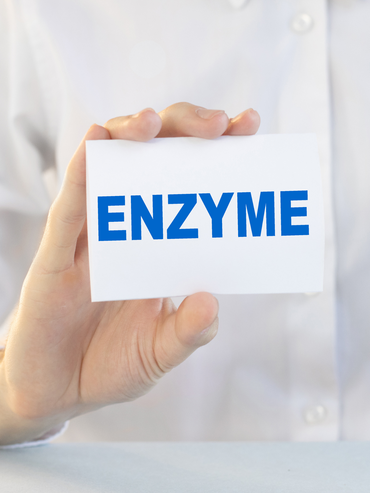 a hand holding a blue and white card that says enzyme