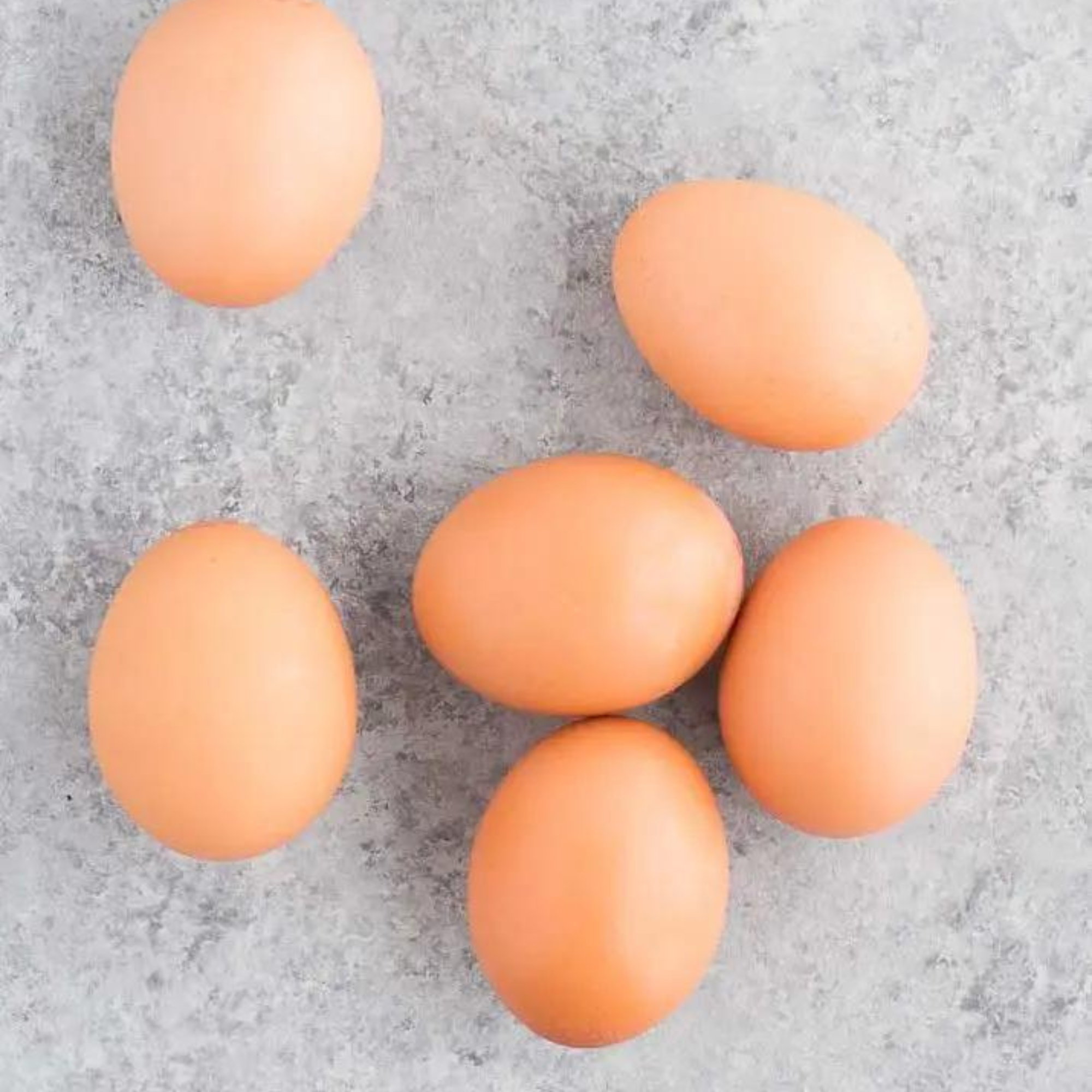 6 hard boiled eggs on a gray tabletop