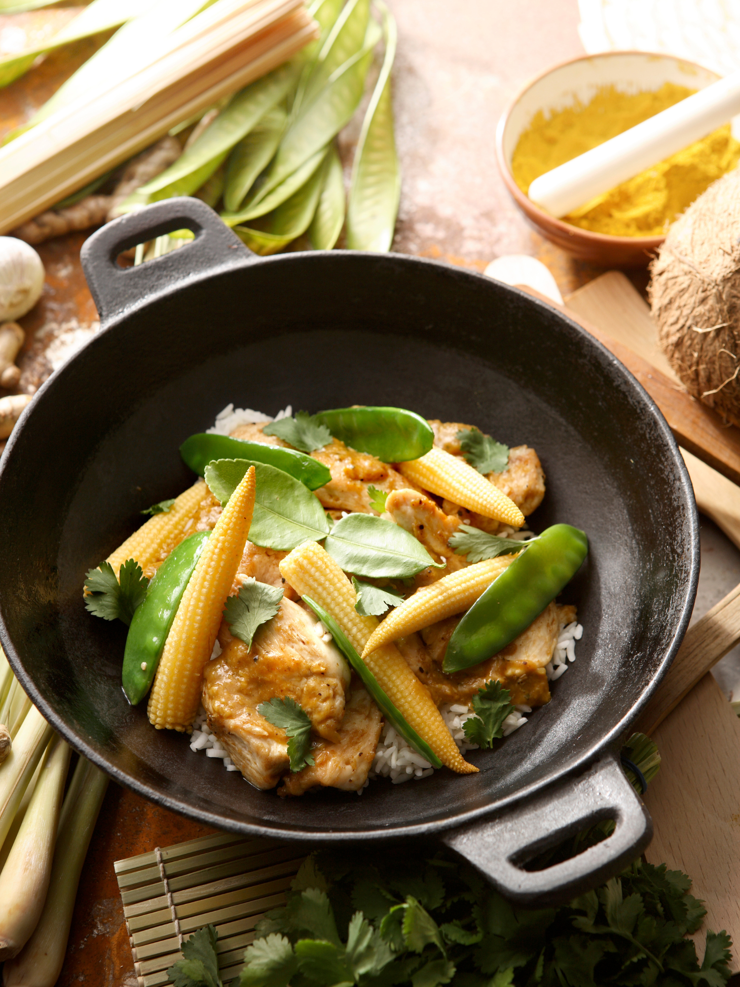 a stir fry pan filled with mixed vegetables