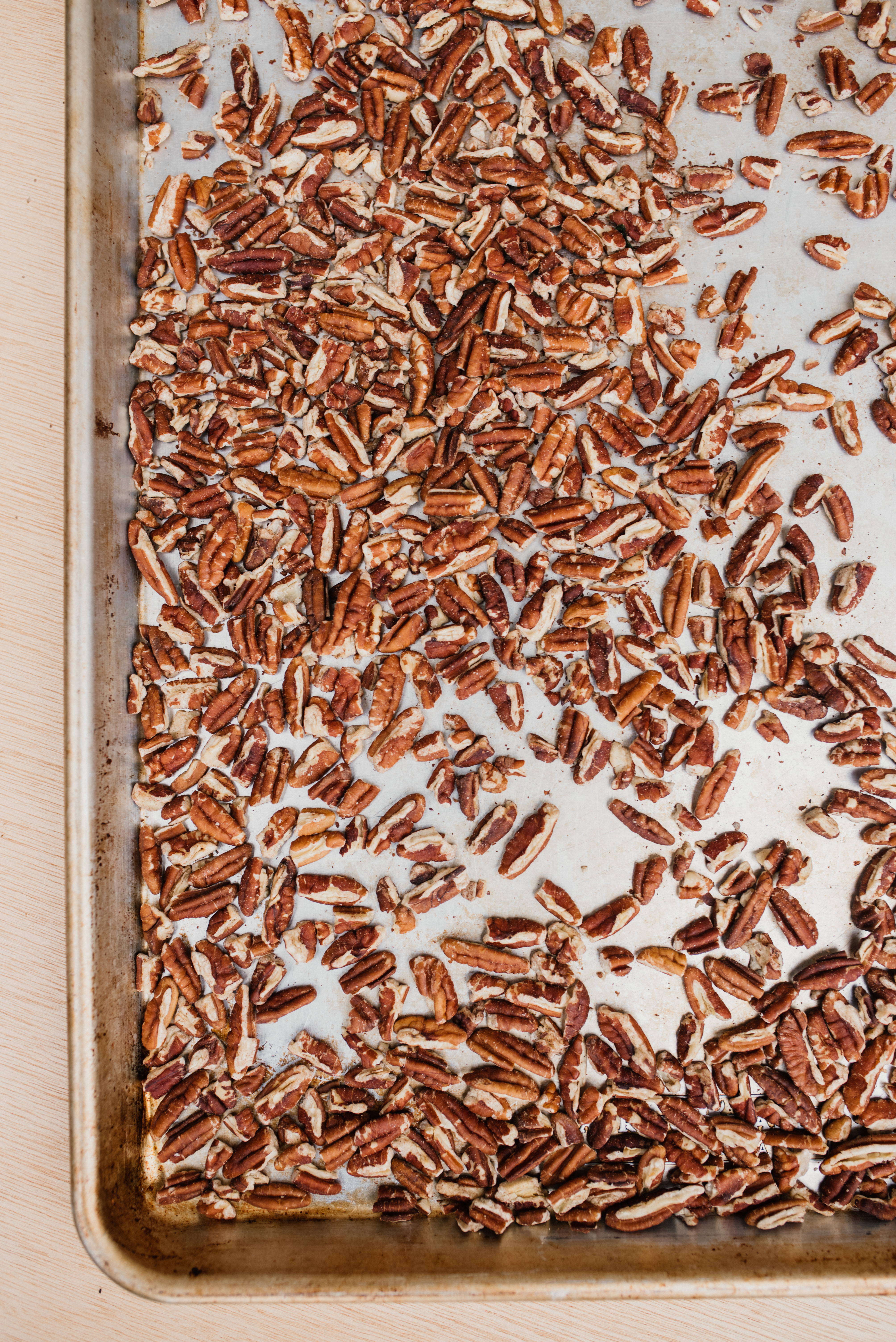 a large cookie sheet of toasted pecans