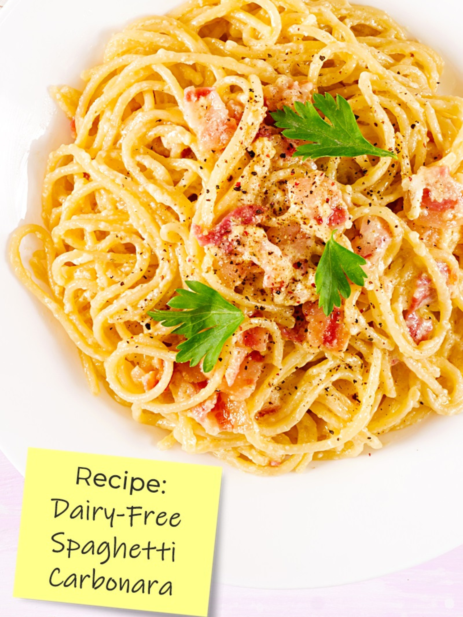 a white bowl filled to the brim with dairy free spaghetti carbonara
