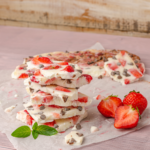 creamy yogurt bark with strawberries on a table