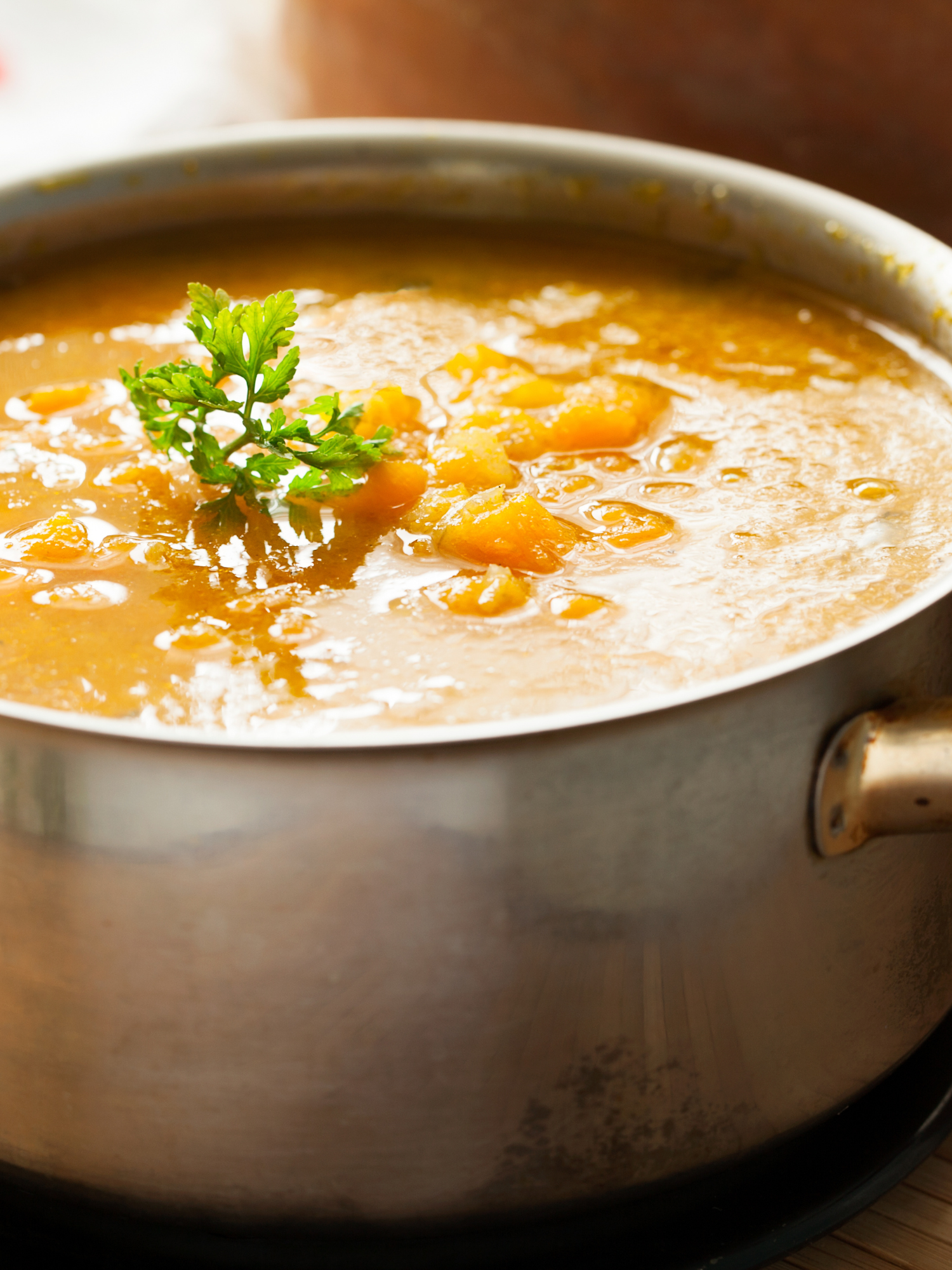 a large soup pot filled with butternut squash soup