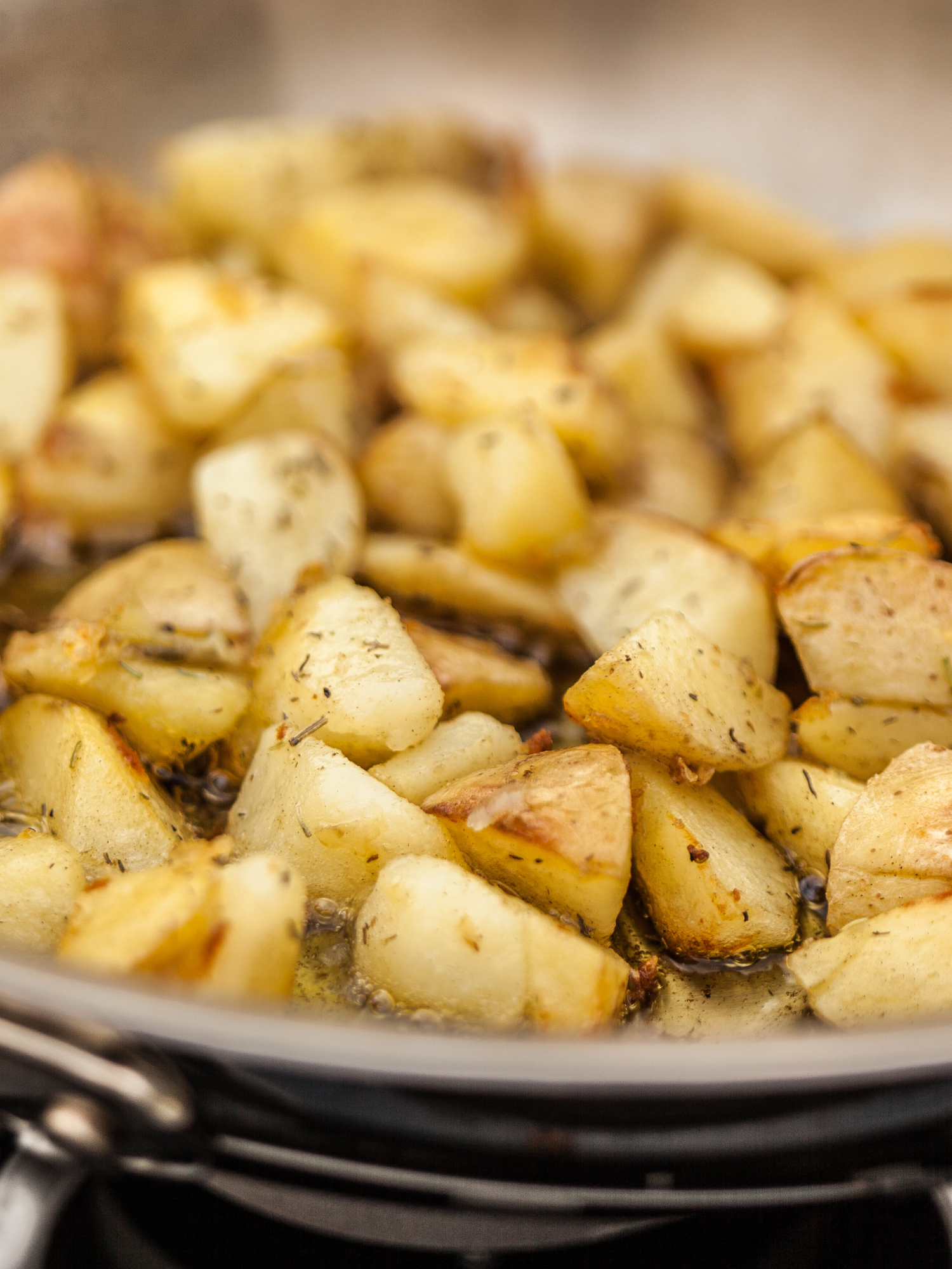 turkish potatoes frying in a skillet